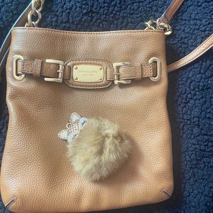 Tan Michael Kors purse that comes with the charm, never used or wore